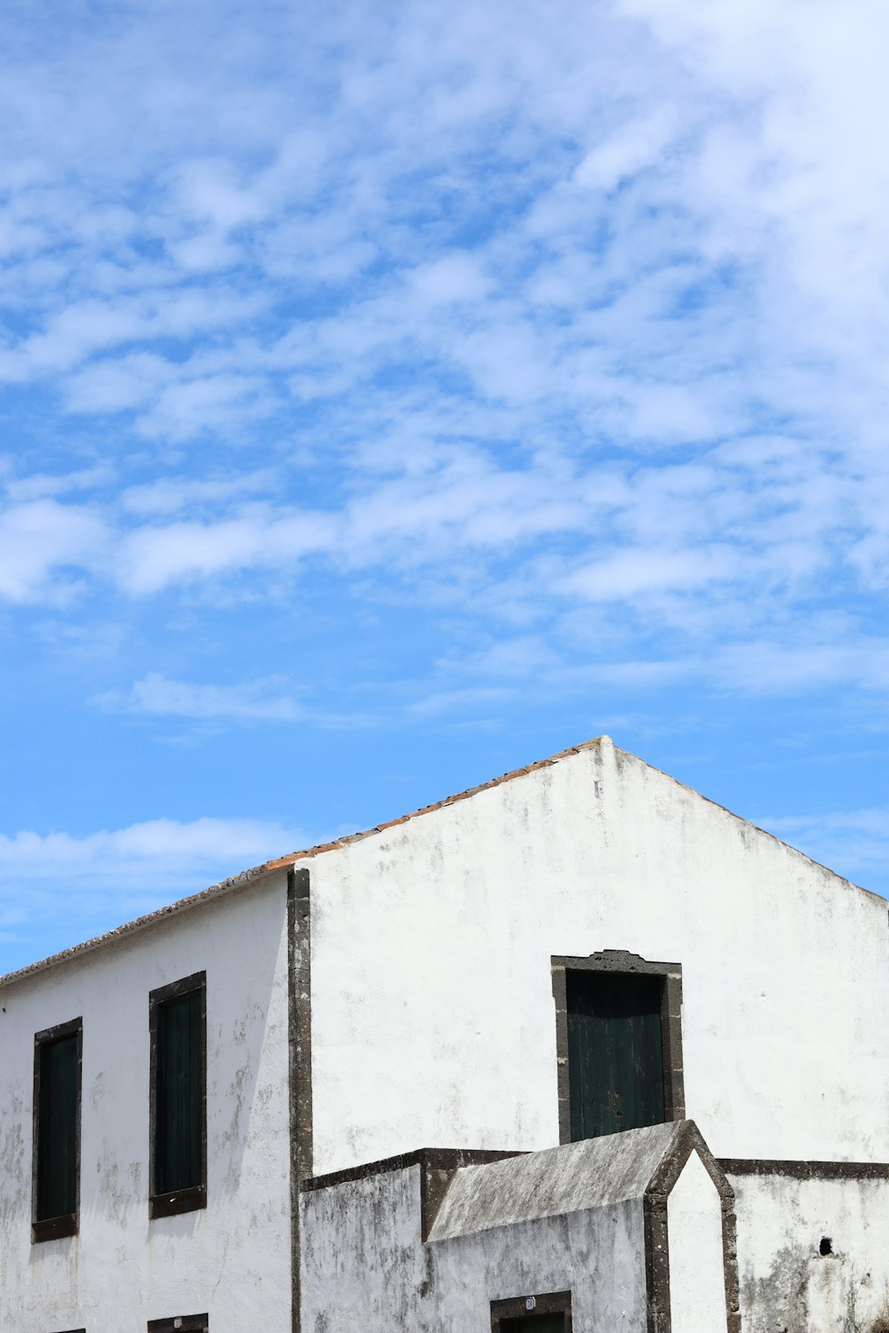 white concrete building under blue sky during daytime