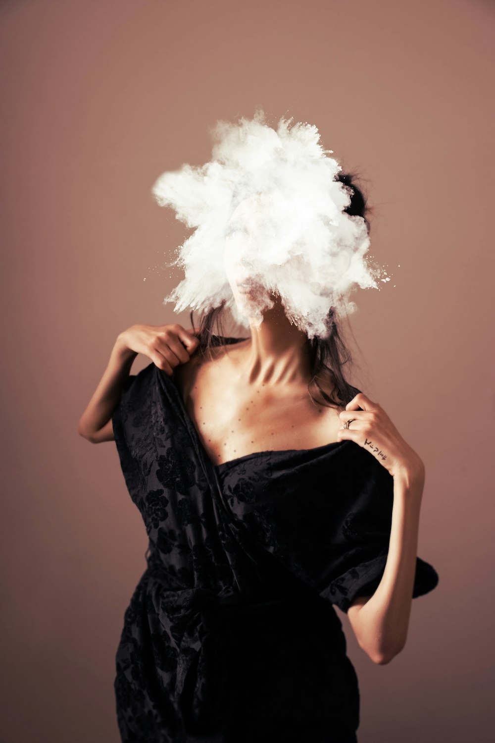 woman in black and white floral dress with white fur on her head