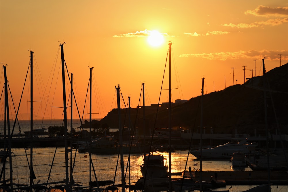 silhouette of boat on dock during sunset