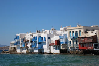 Whitewashed buildings of Algiers' Casbah contrasting with the deep blue Mediterranean sky.
