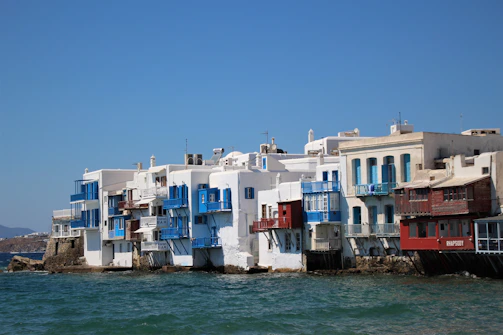 Whitewashed buildings of Algiers' Casbah contrasting with the deep blue Mediterranean sky.