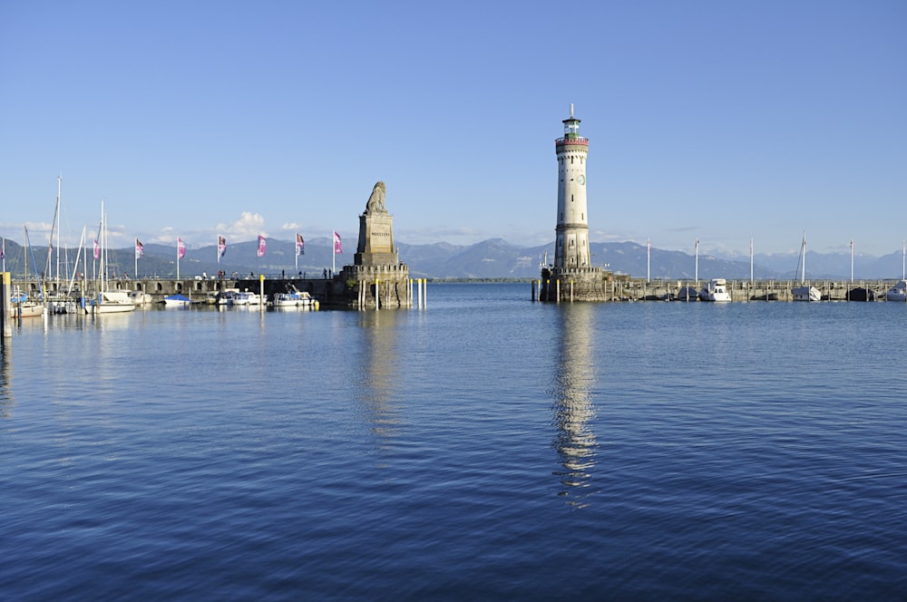 white and brown concrete building near body of water during daytime