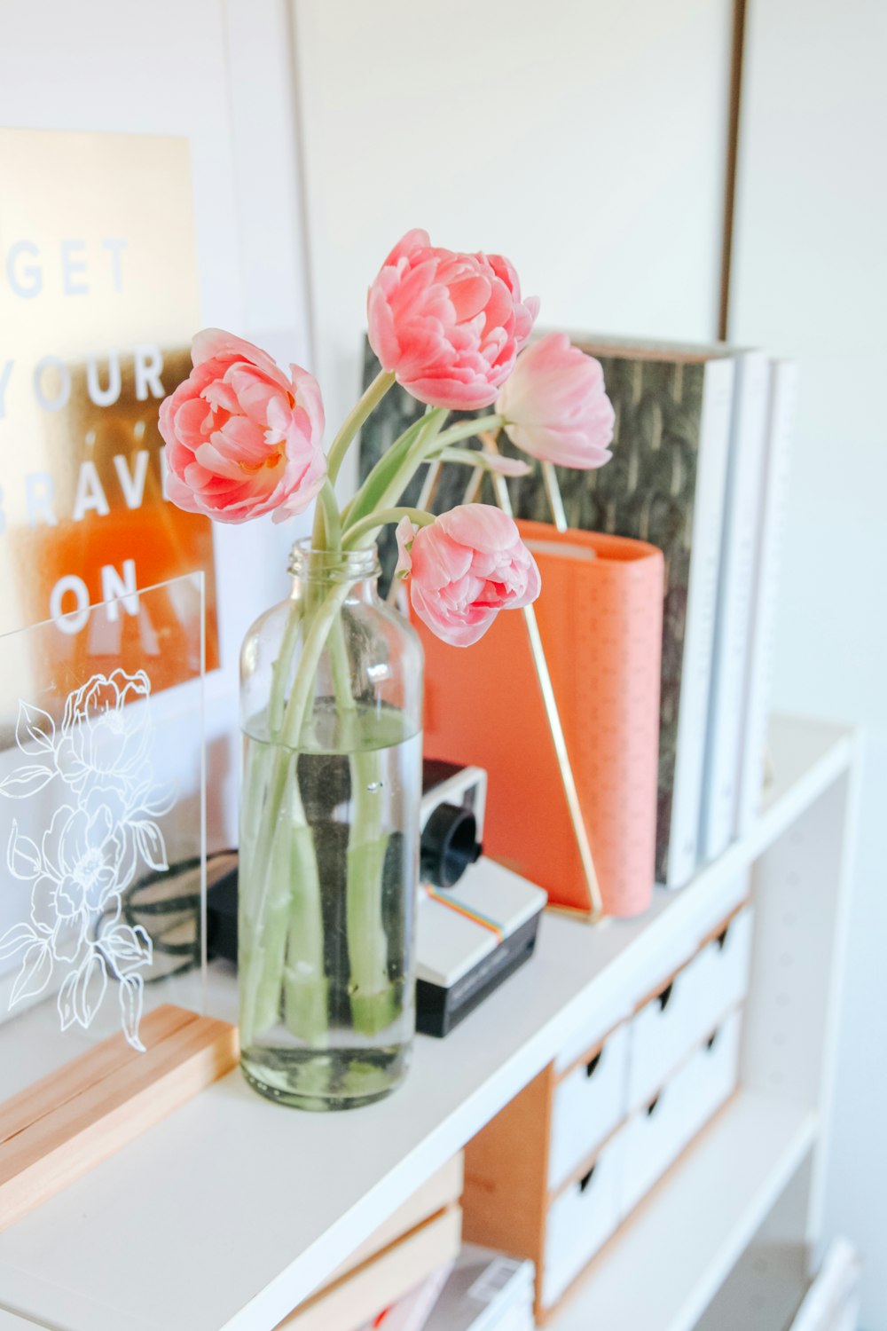 pink roses in clear glass vase