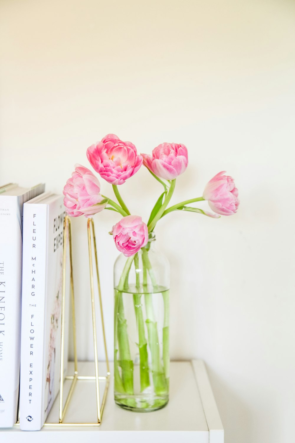 pink roses in clear glass vase