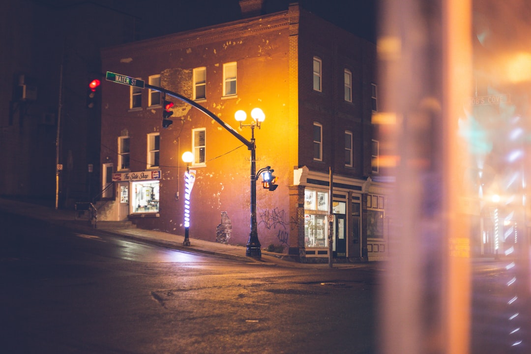 black street light turned on during night time