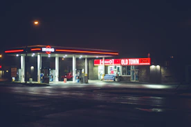 red and white store front during night time