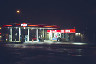 red and white store front during night time