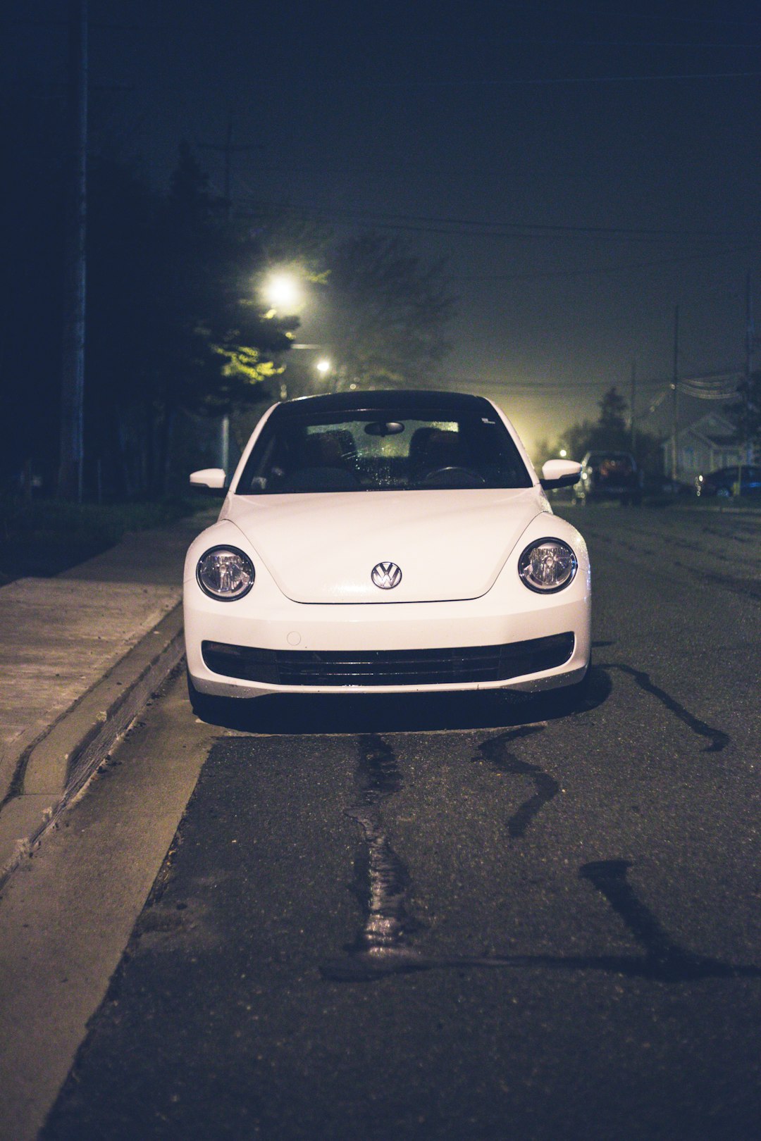 white bmw car on road during night time