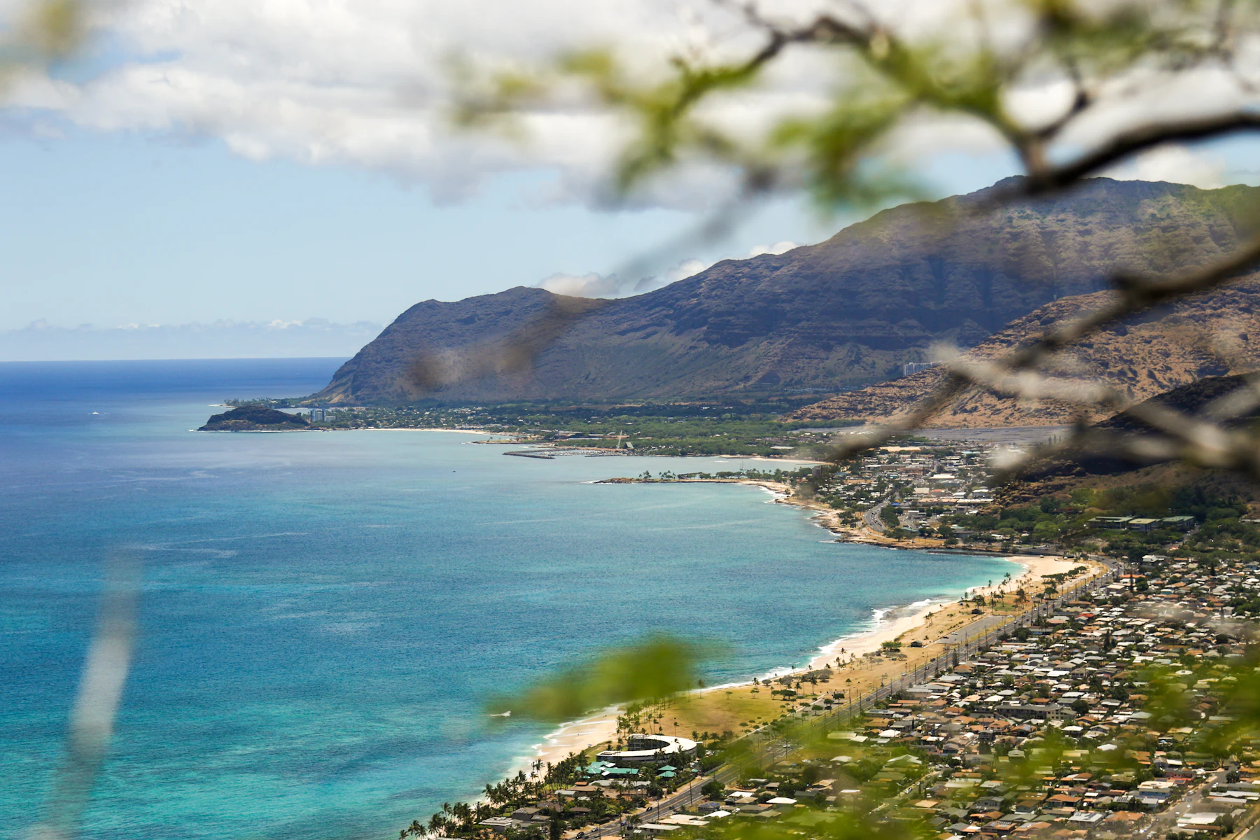 Green Waiʻanae mountains beside the ocean on Oʻahu's west side