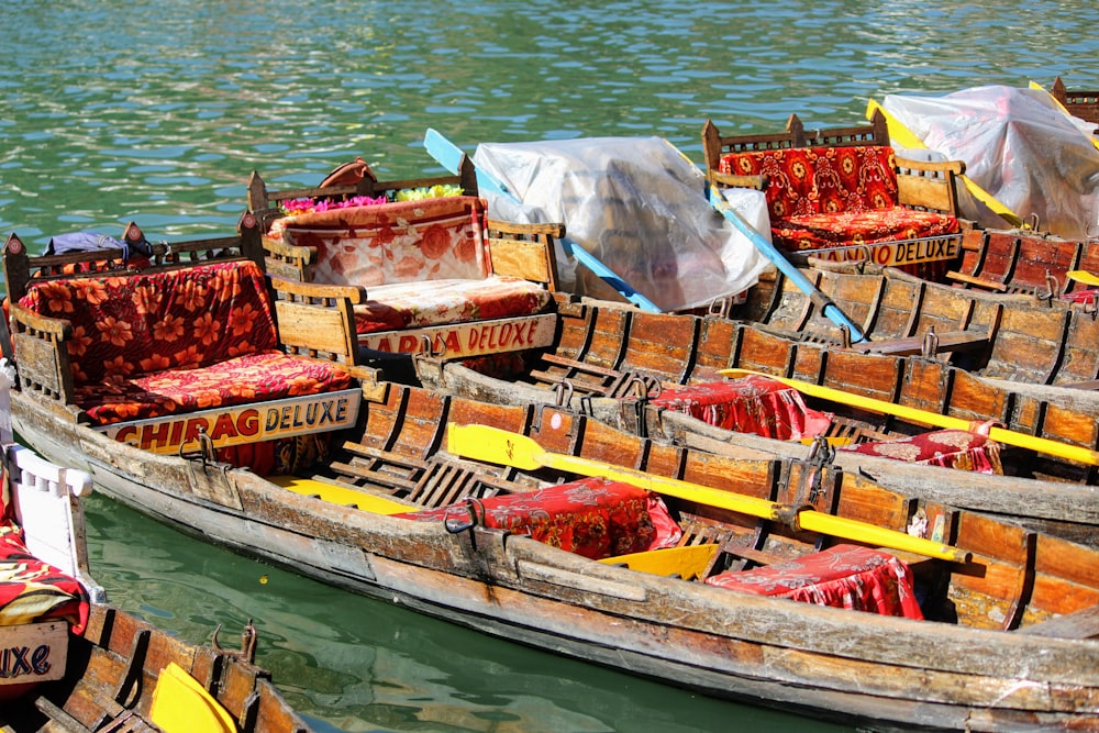 brown and white boat on body of water during daytime