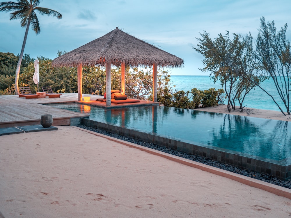 brown wooden house near swimming pool during daytime