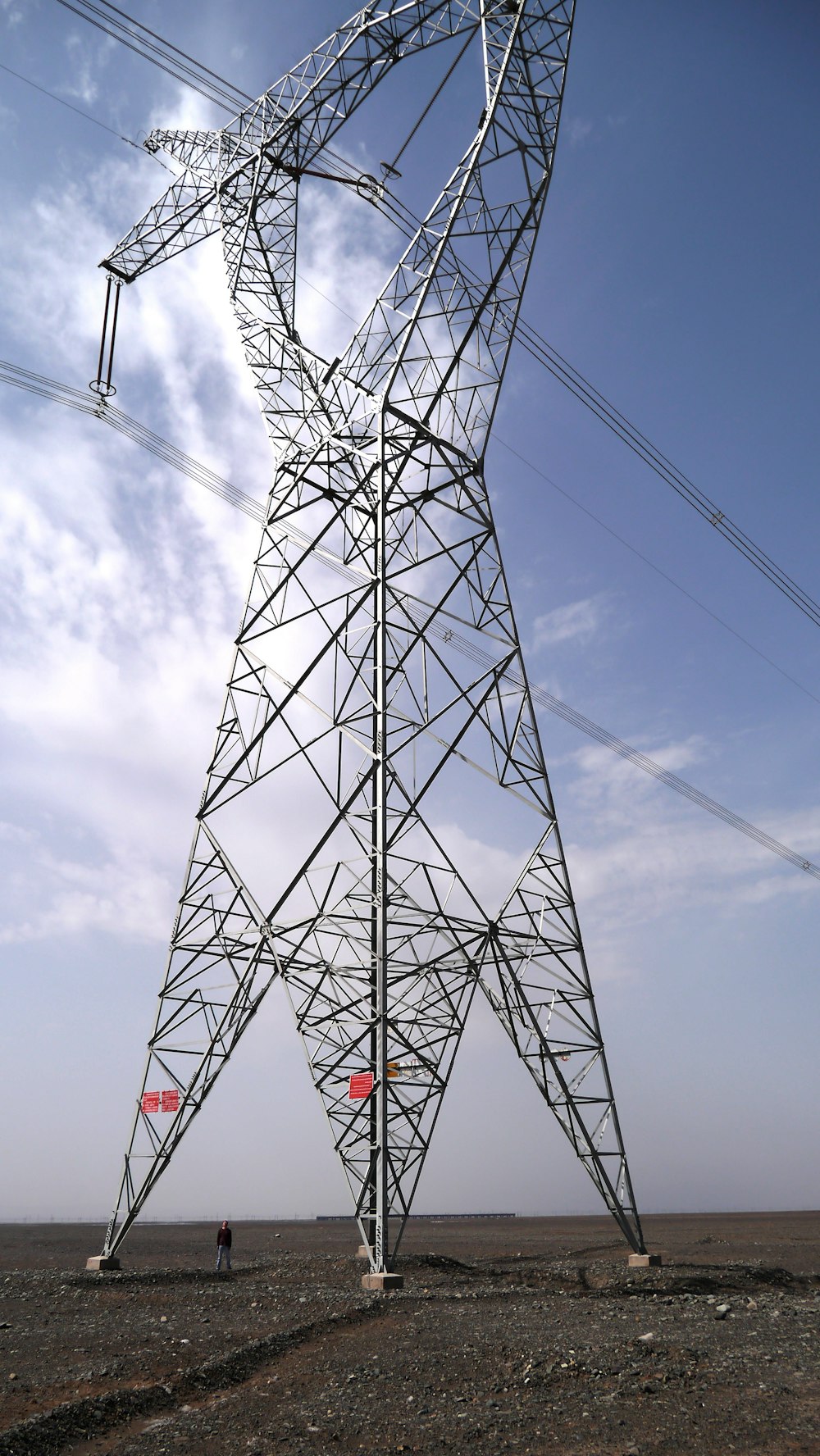 black and white electric tower under blue sky