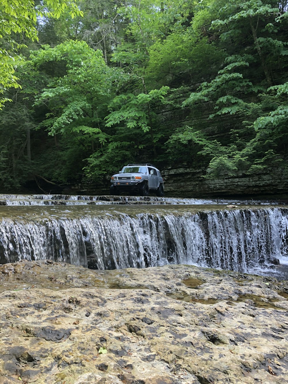 white van on river during daytime