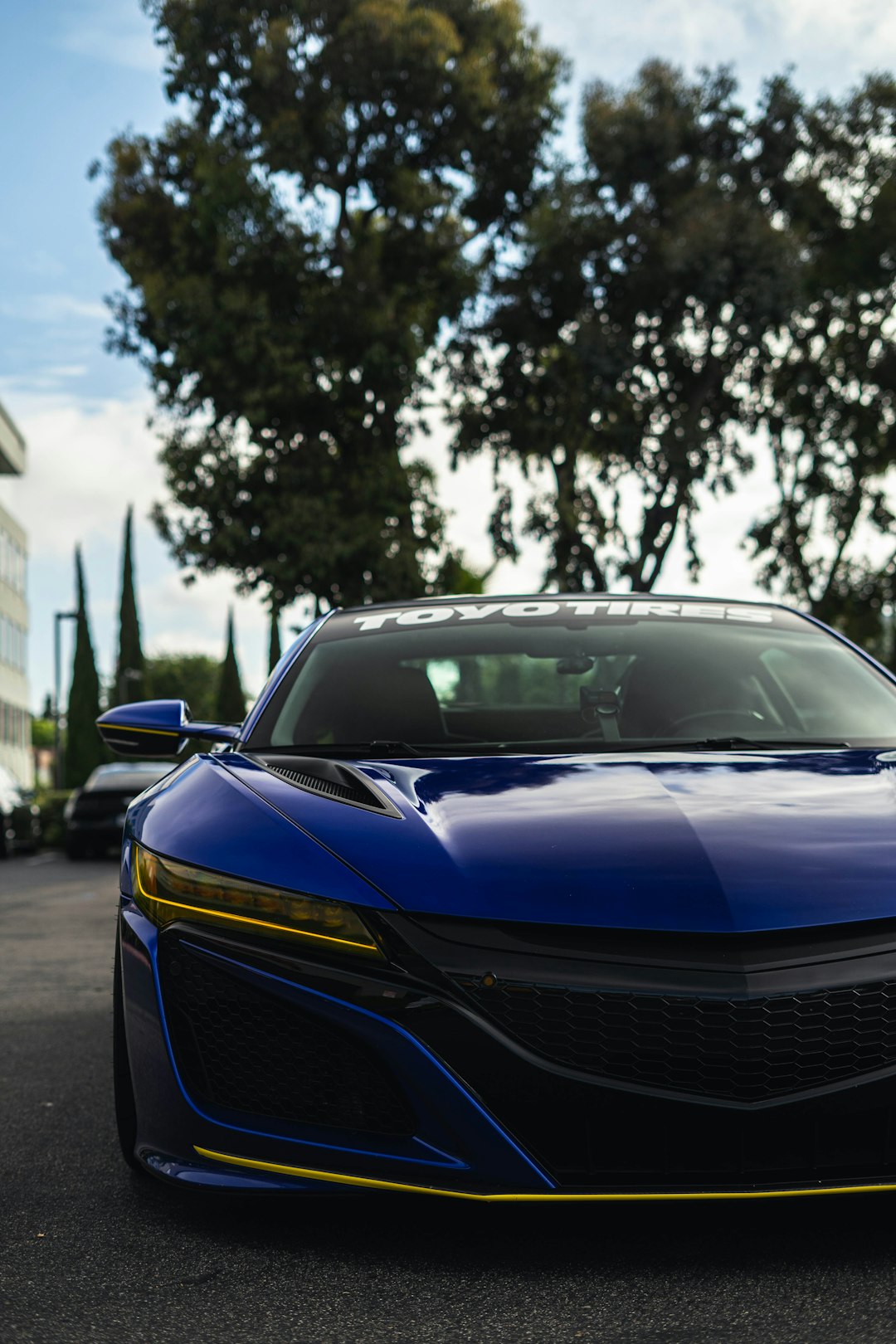 blue and black car on road during daytime