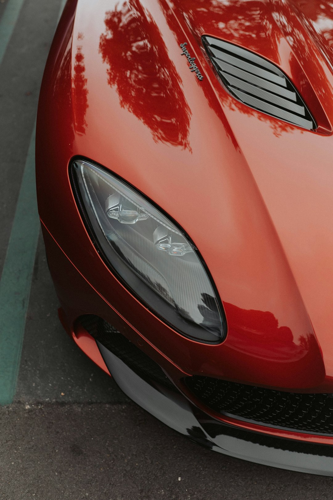 red car on gray concrete road