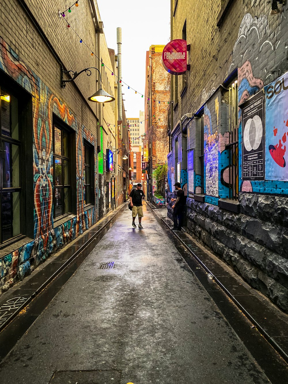 people walking on sidewalk during daytime