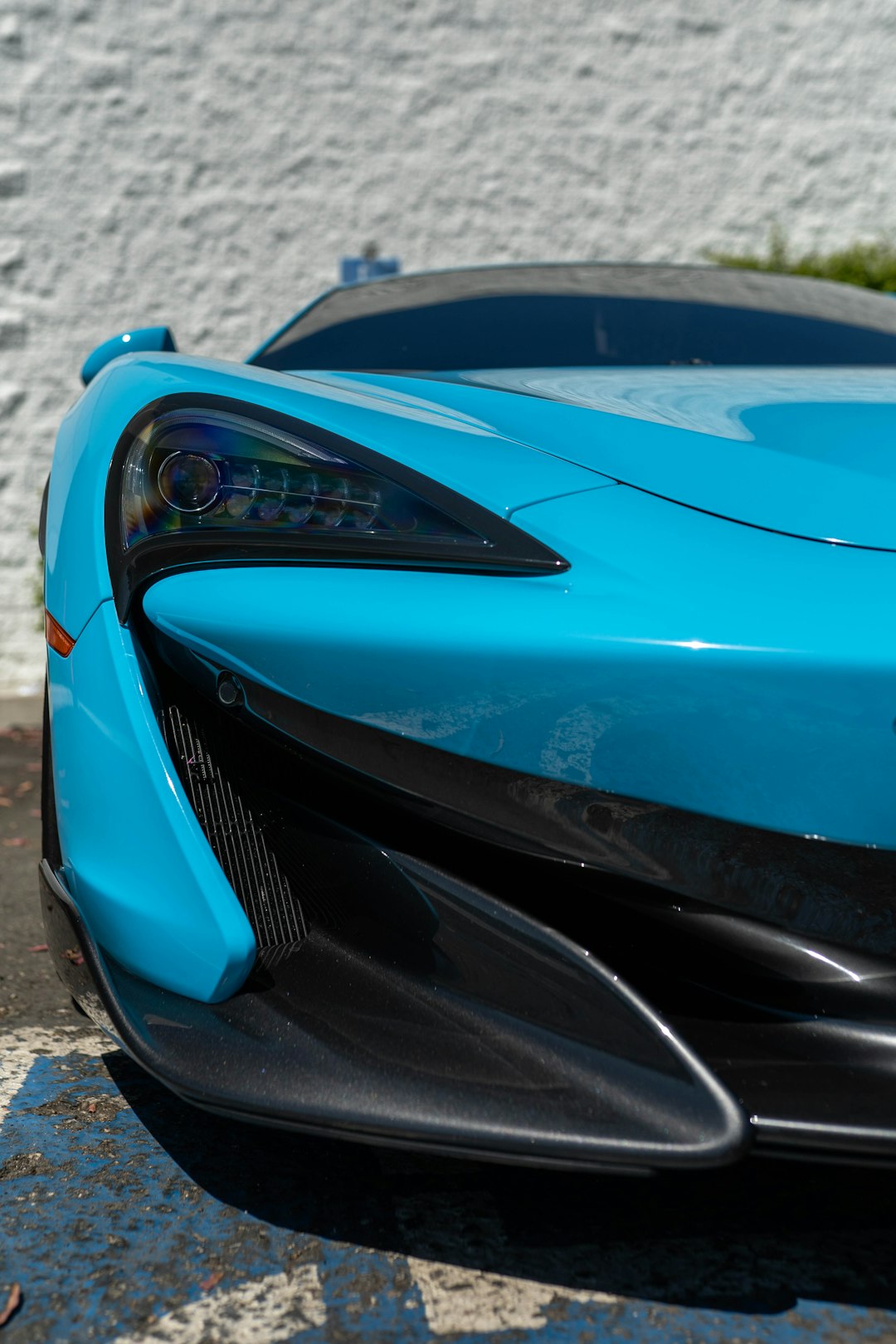 blue ferrari 458 italia on gray concrete pavement