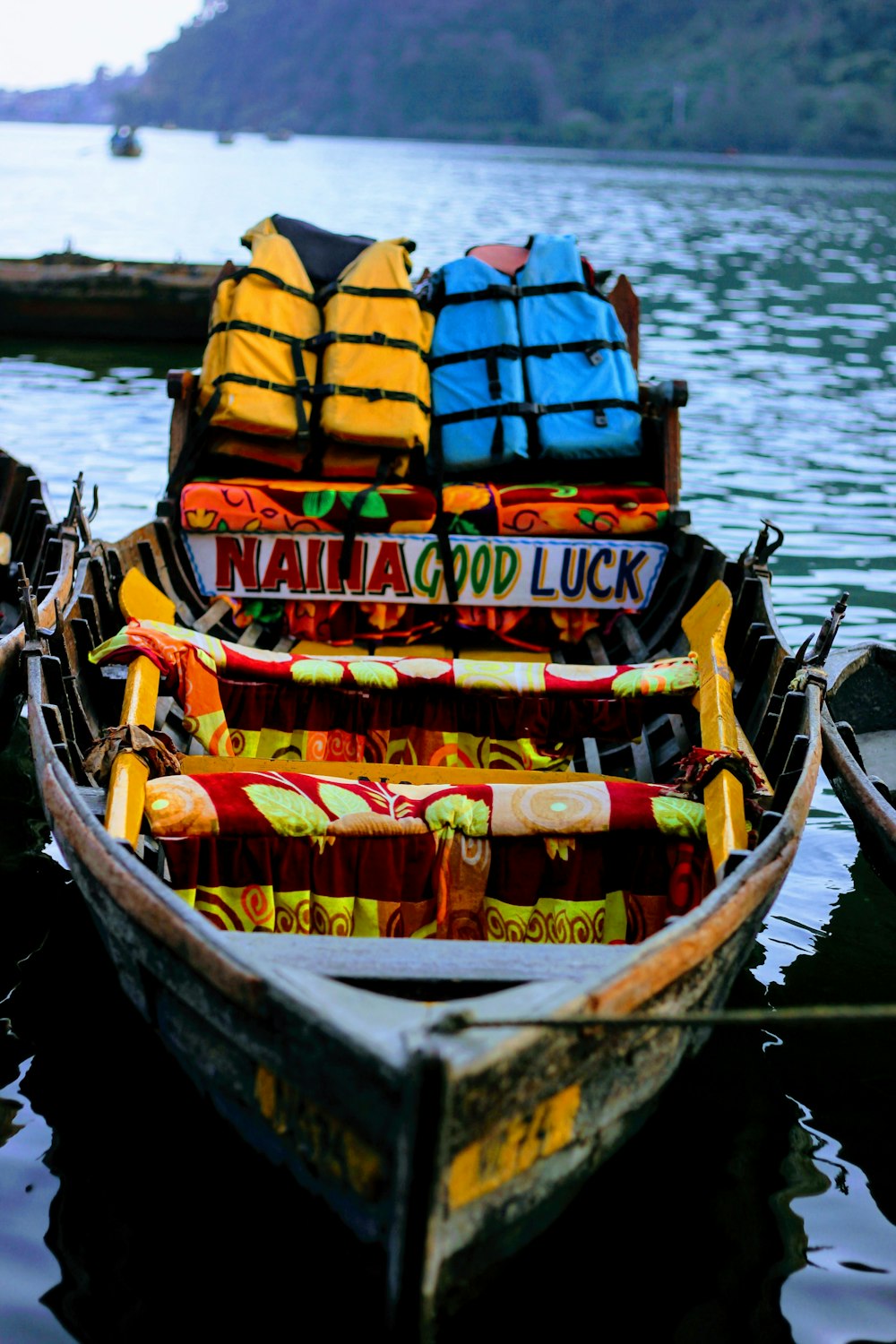 yellow and red kayak on body of water during daytime