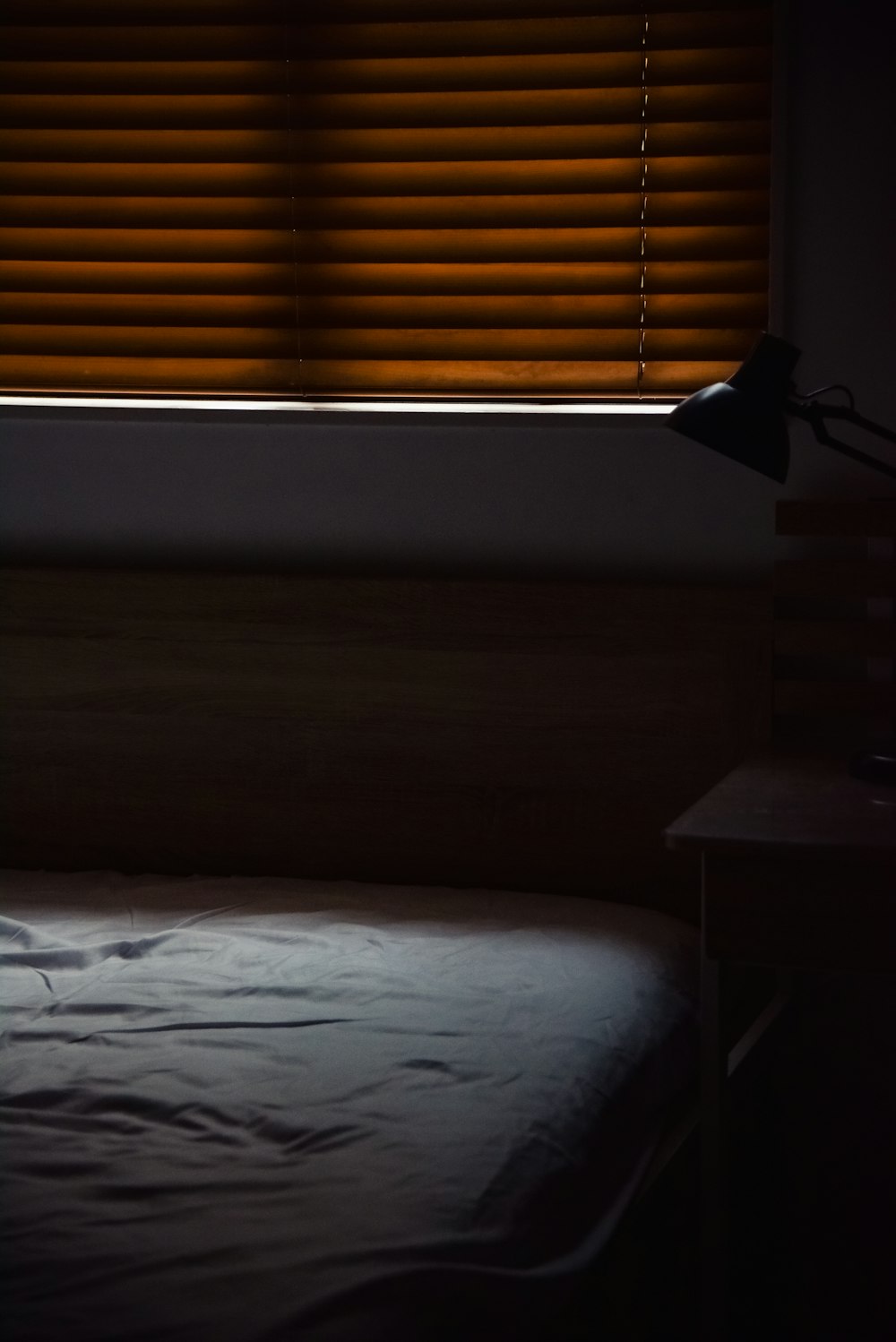 white bed linen near window