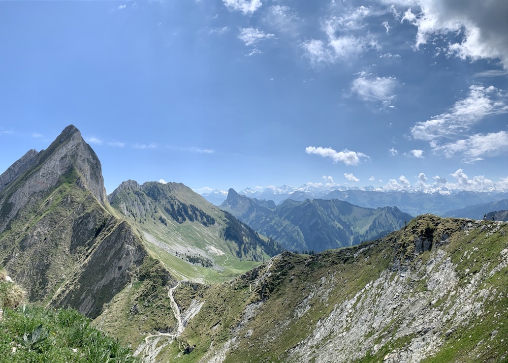 green and brown mountains under blue sky during daytime