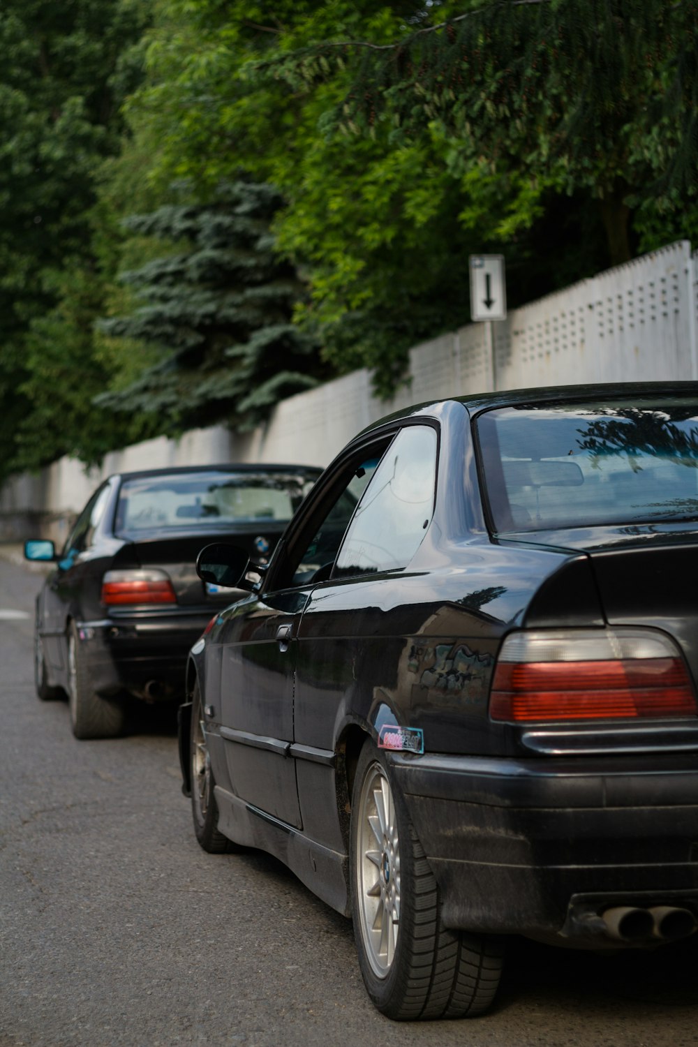 black sedan on road during daytime