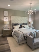 white bed linen on bed