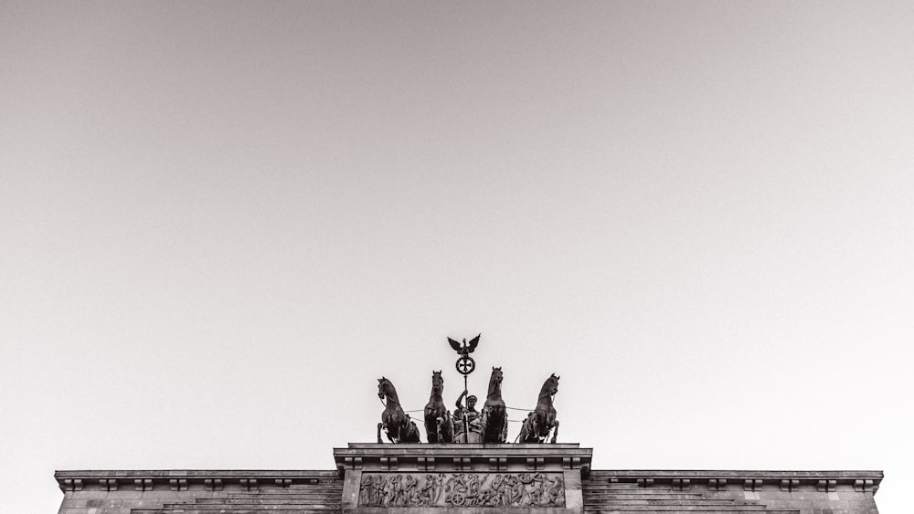 black statue of man riding horse