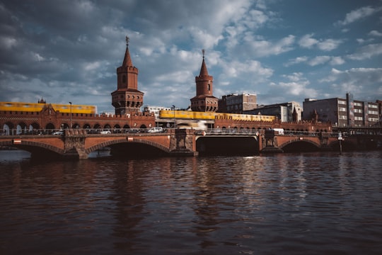 brown concrete bridge over river during daytime in Pirates Berlin Germany