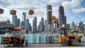yellow and black auto rickshaw near city buildings during daytime