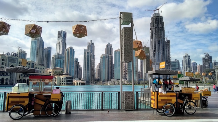 yellow and black auto rickshaw near city buildings during daytime