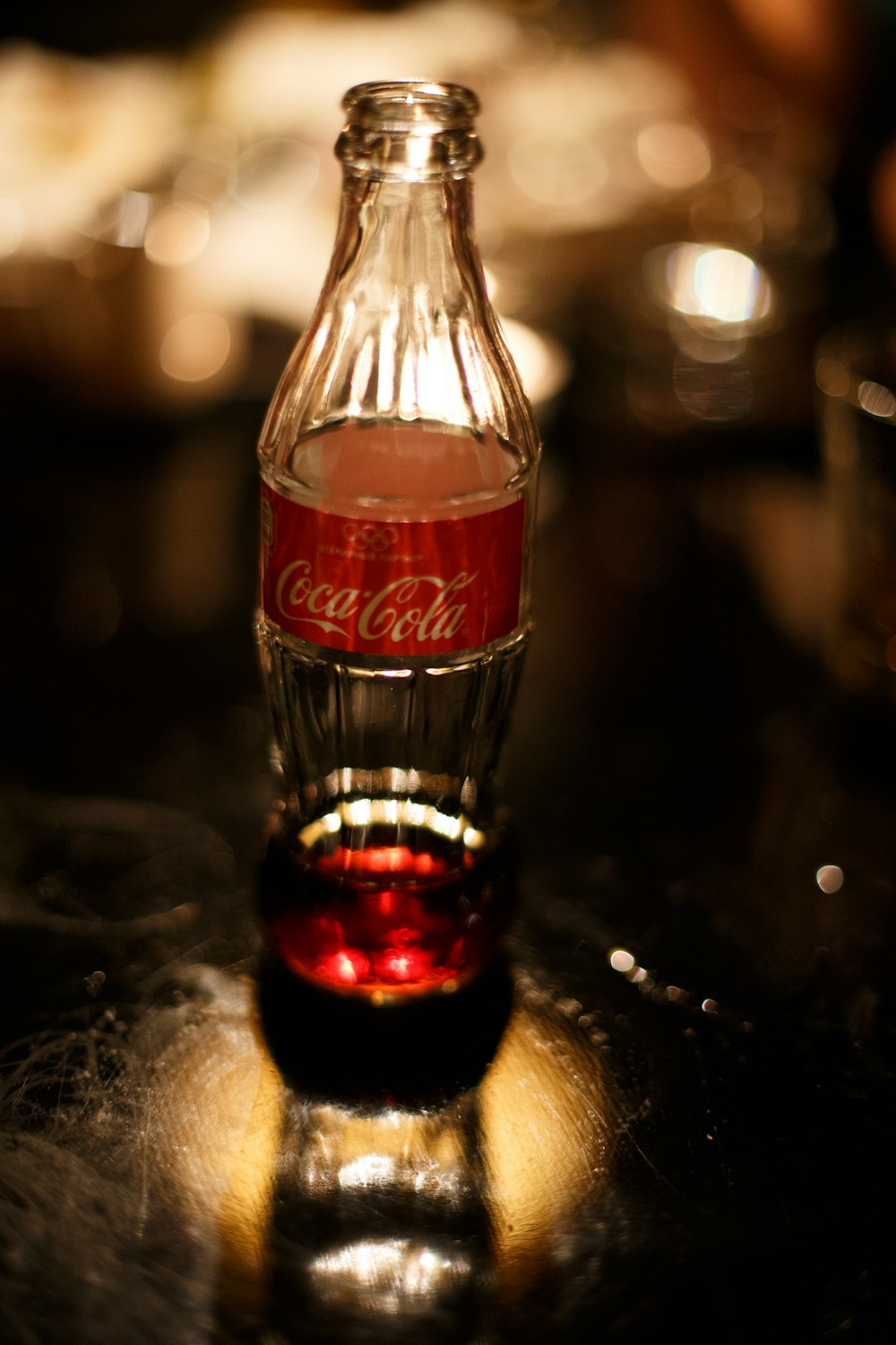 coca cola bottle on black table