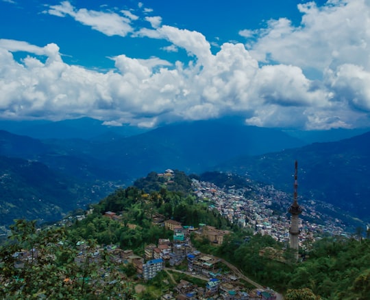 aerial view of city under cloudy sky during daytime in Sikkim India