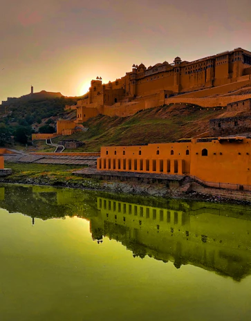 A majestic Rajasthan fort glowing under the golden sunset, showcasing intricate royal architecture.