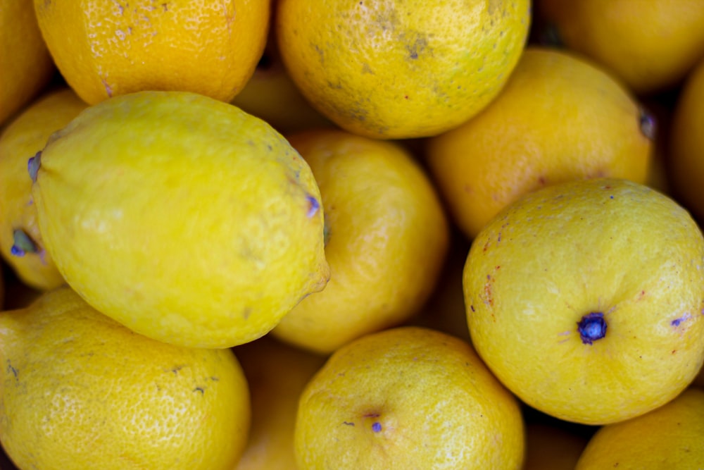 yellow citrus fruit on black surface