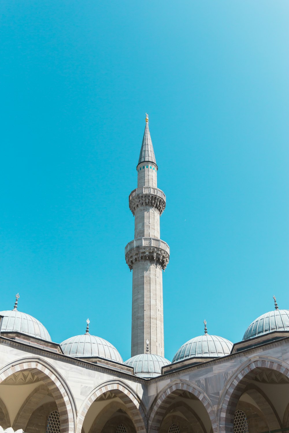 white and green dome building under blue sky during daytime