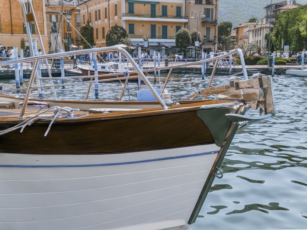 white and brown boat on water