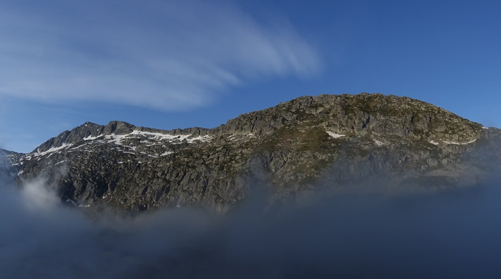 gray and white mountain under blue sky during daytime