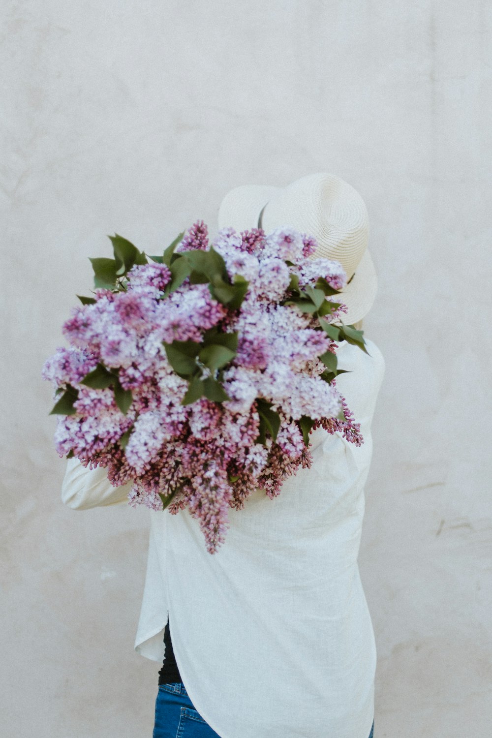 purple flowers on white hat