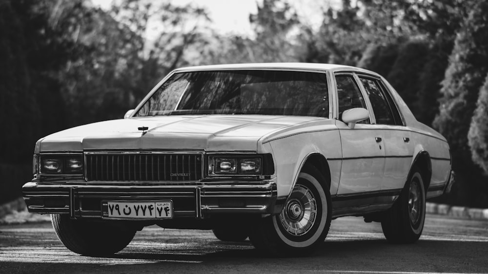 grayscale photo of classic car