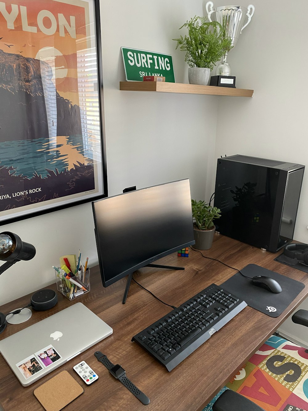 black flat screen computer monitor and black computer keyboard on brown wooden desk
