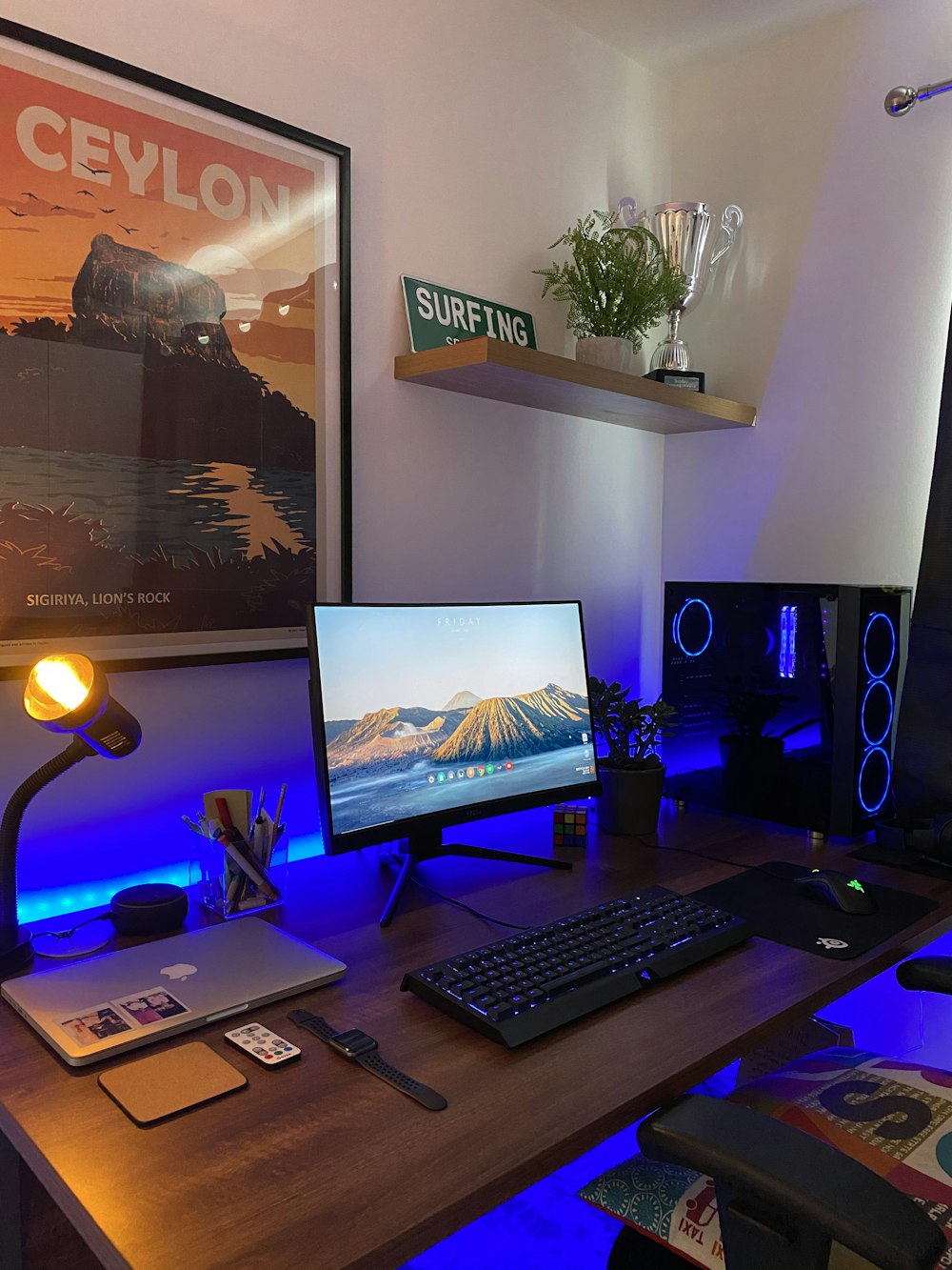 black flat screen computer monitor on brown wooden desk