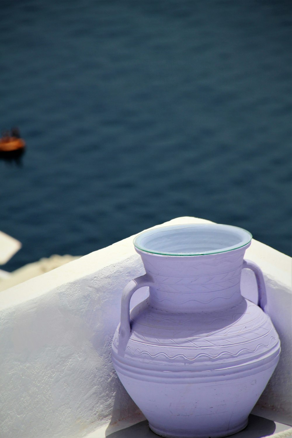 white ceramic teapot on white table