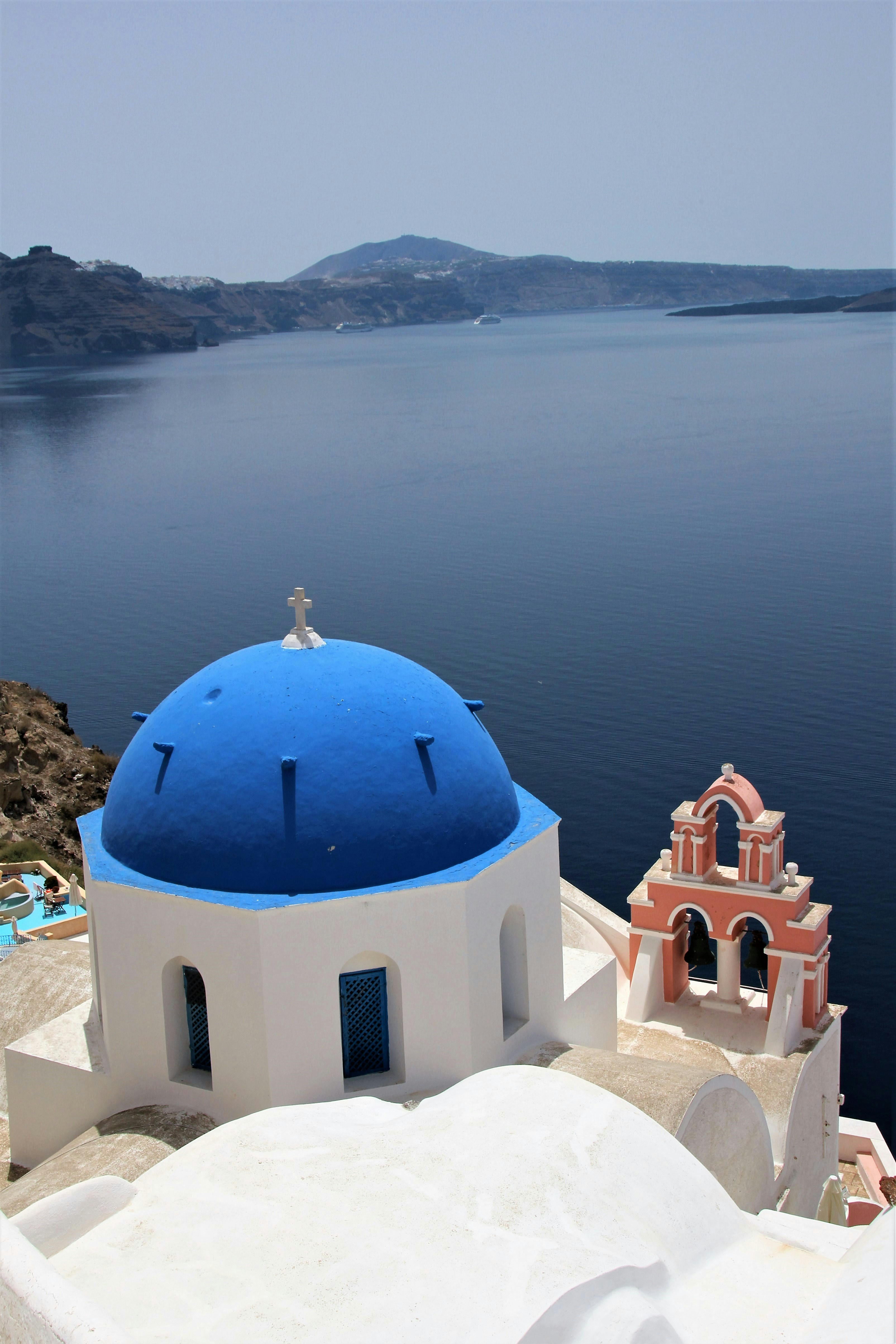 white and blue dome building near body of water during daytime
