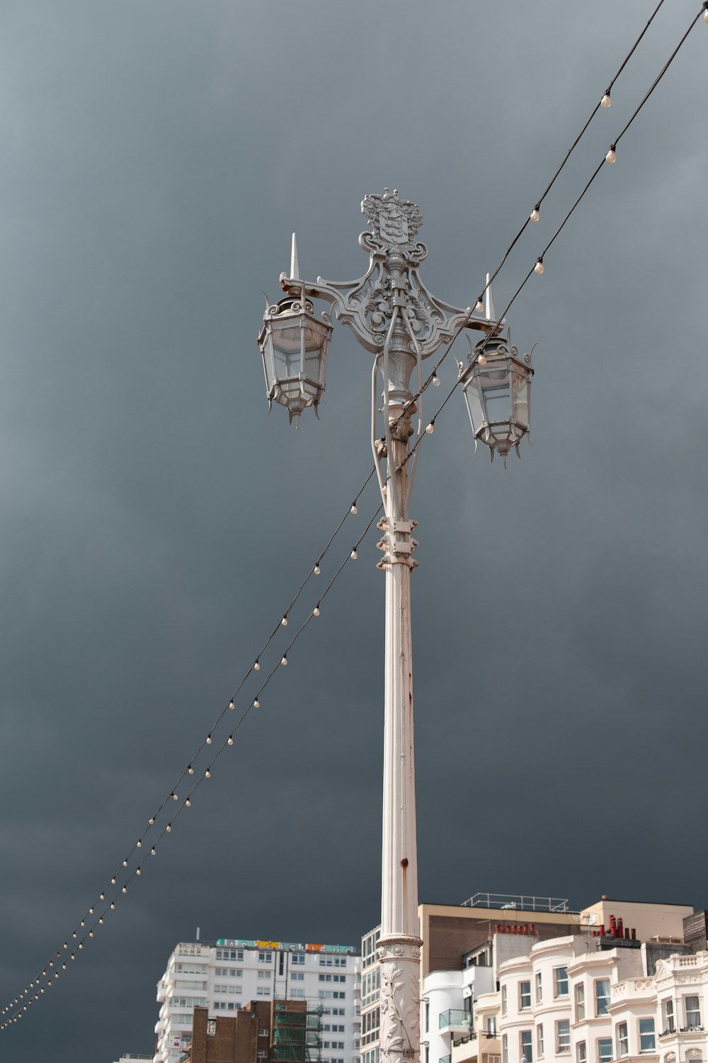 white and brown metal tower under blue sky