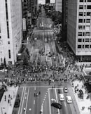 grayscale photo of people walking on street