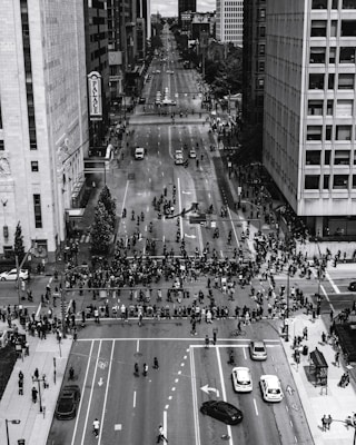 grayscale photo of people walking on street