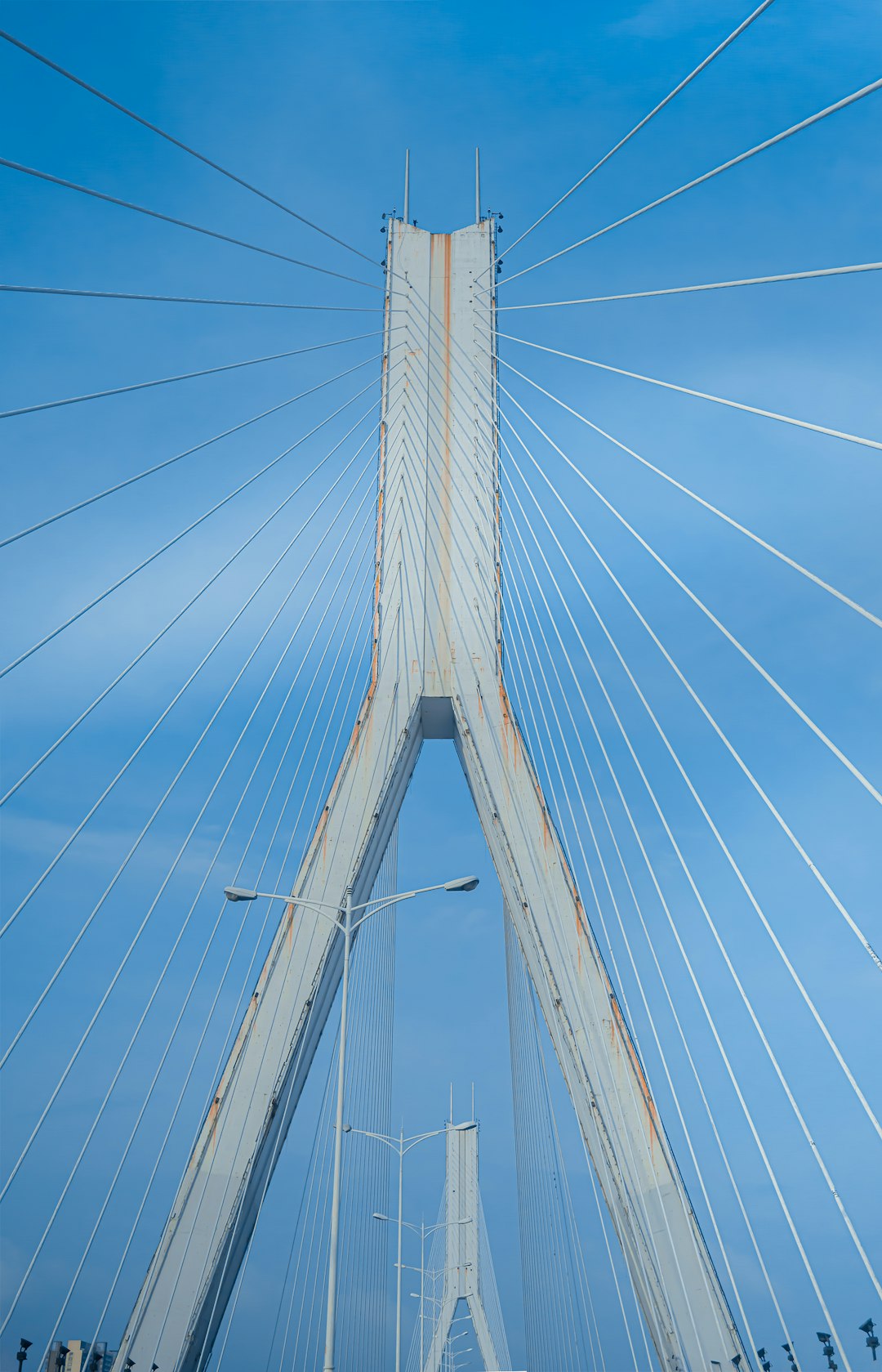 white and blue bridge under blue sky during daytime