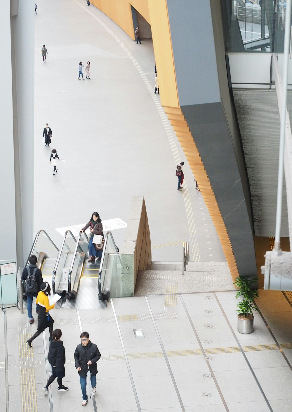 people walking on white tiled floor