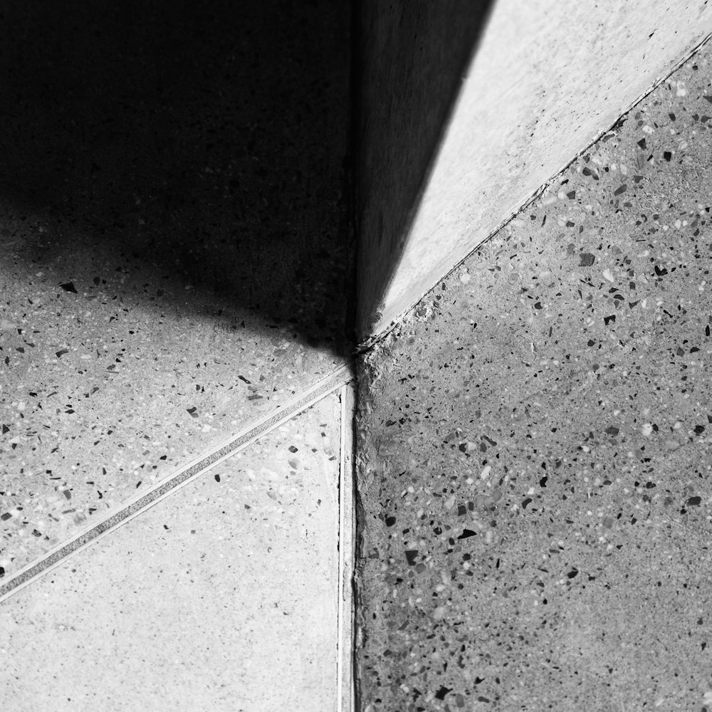 grayscale photo of concrete floor