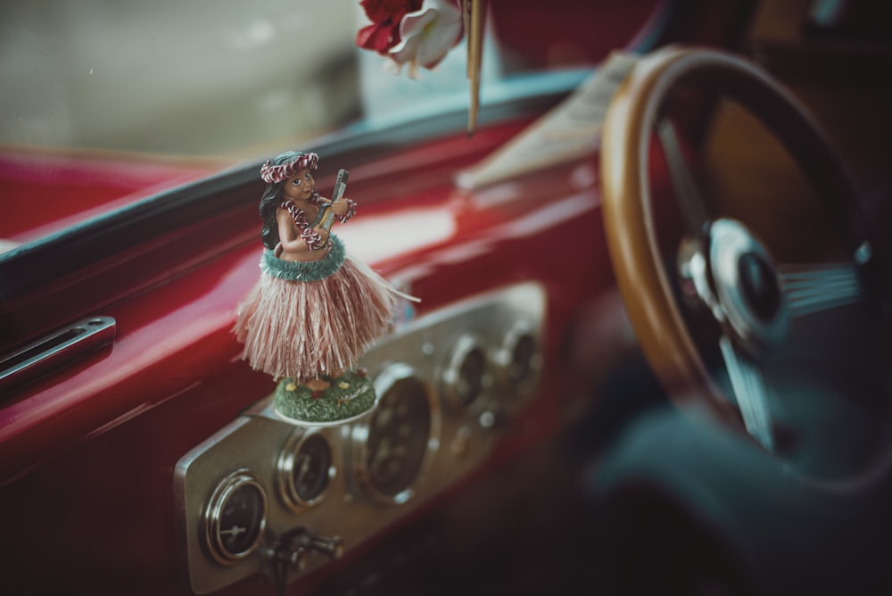 red and gold car steering wheel